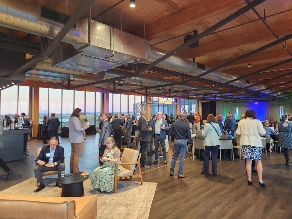 Industry members and influencers network at the 2025 Nuts & Bolts Bash fundraiser hosted by Manufacturing Works Cleveland and held at the Truss Cleveland venue in Cleveland's Ohio City neighborhood.